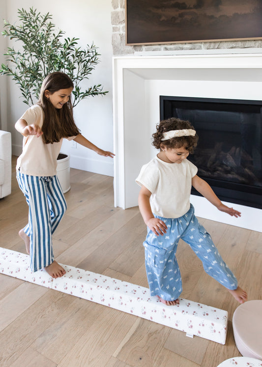 Toddler practicing balance on North&Nova balance beam