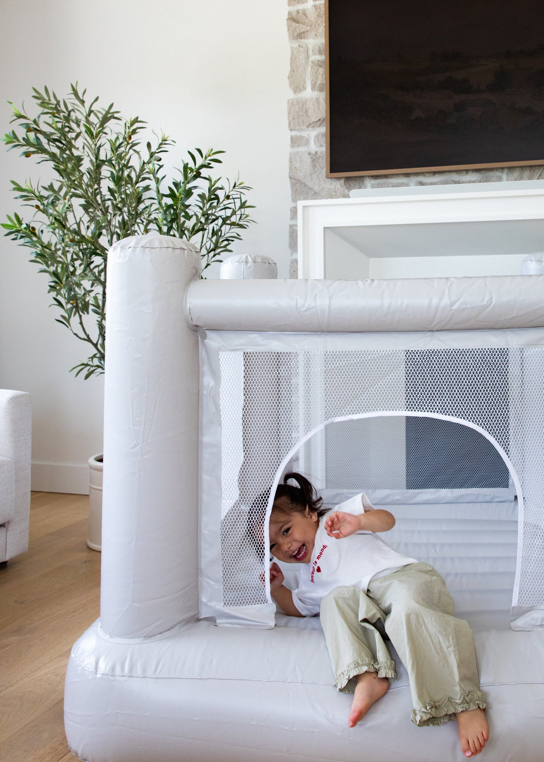 Child playing on aesthetic north&nova Mini Bounce House